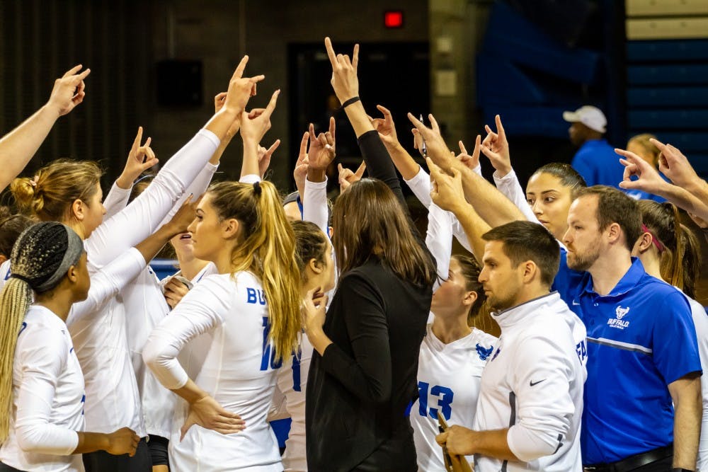 <p>The Bulls celebrate after a match by putting up the “UB horns up” hand gesture. Buffalo went 2-0 this weekend with back-to-back sweeps at home.</p>