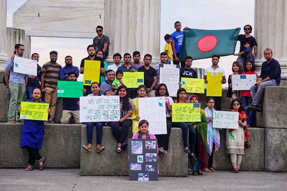 <p>The Bangladeshi Student Association stands outside of Baird Point’s pillars in the summer. SA derecognized the club due to its lack of an e-board this semester.</p>
