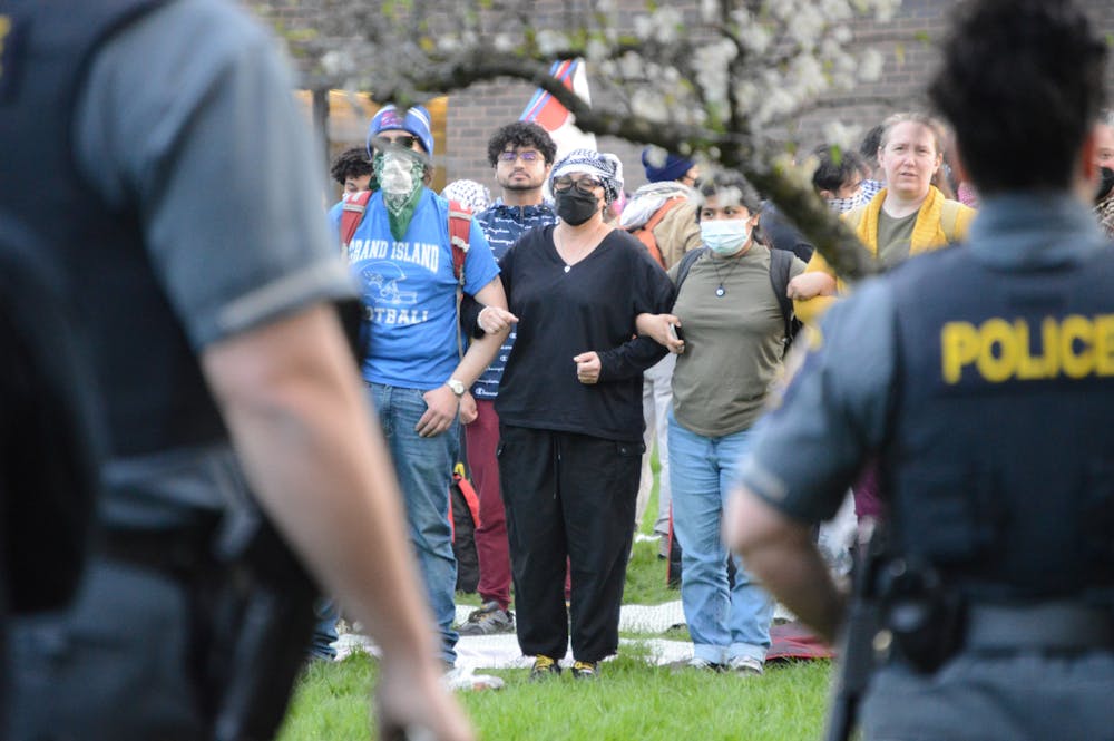 <p>Protesters linked arms around fellow, praying demonstrators as police prepared to clear the area.&nbsp;</p>