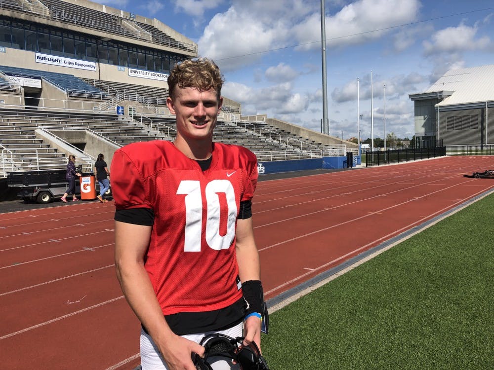 <p>Matt Myers stands on sidelines of UB Stadium.</p>