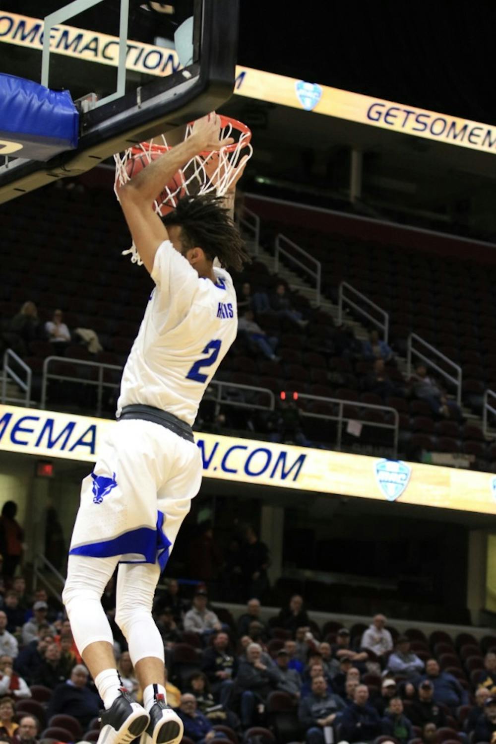 <p>Junior guard Jeremy Harris with the slam dunk at this years&nbsp;MAC Championship. The Bulls lost in the second round of the NCAA tournament on Saturday to the Kentucky Wildcats.</p>