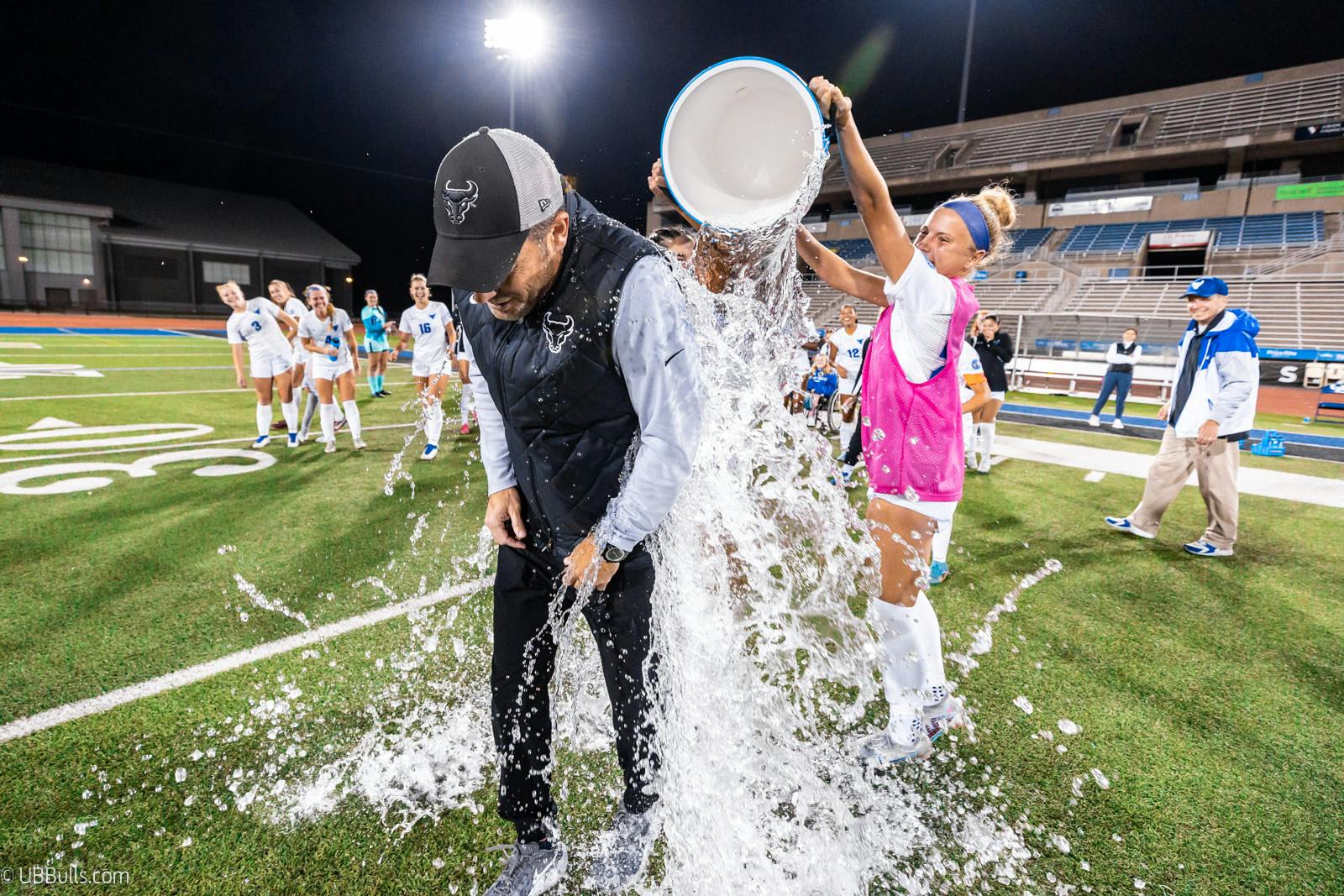 Coach Burke gets a Powerade shower to celebrate 100 career wins | Paul Hokanson, UB Athletics