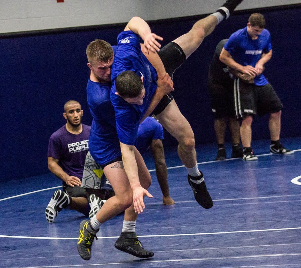 <p>Two UB wrestlers grapple. The Bulls nearly upset No. 7 ranked Cornell this weekend.</p>