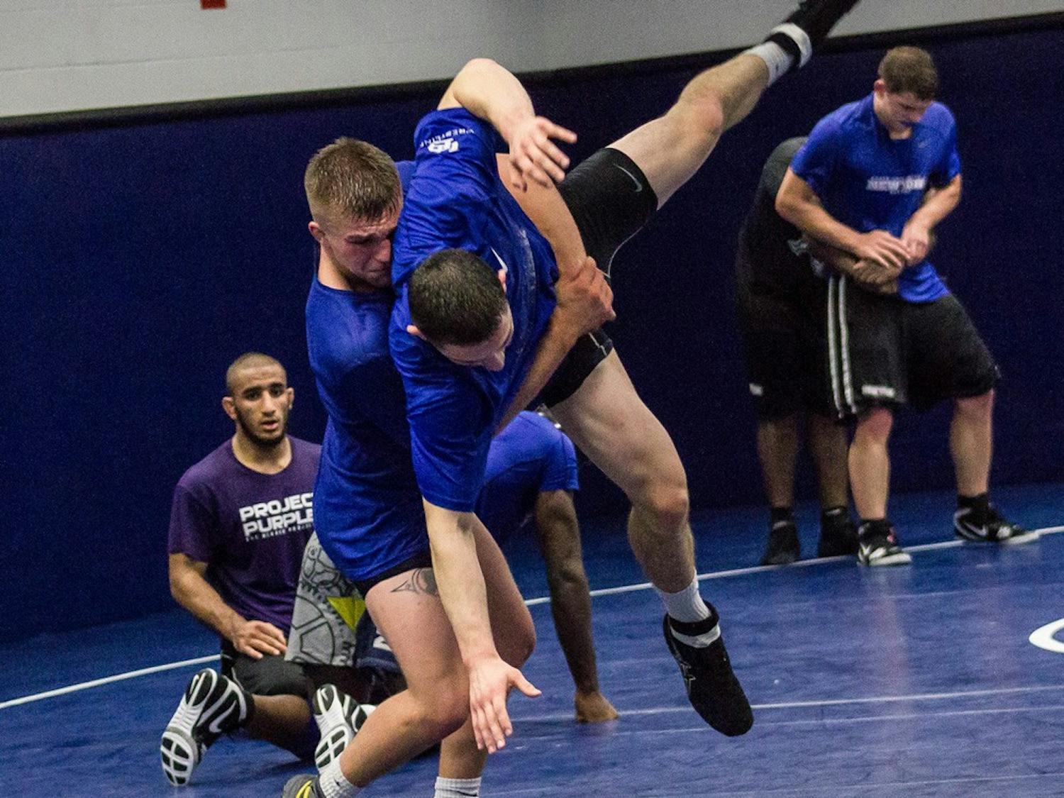 Two UB wrestlers grapple. The Bulls nearly upset No. 7 ranked Cornell this weekend.