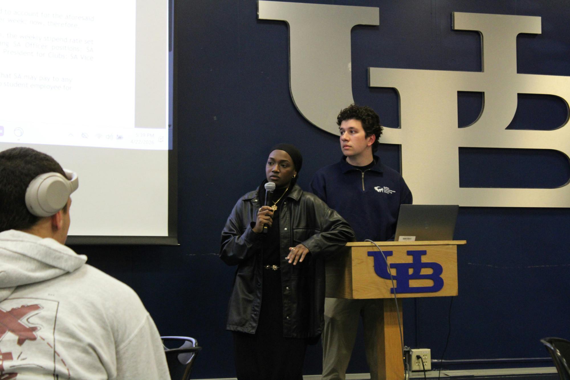 SA President Aisha Adam introduces the resolution that would increase e-board wages by at least three percent during a Senate meeting Wednesday evening.