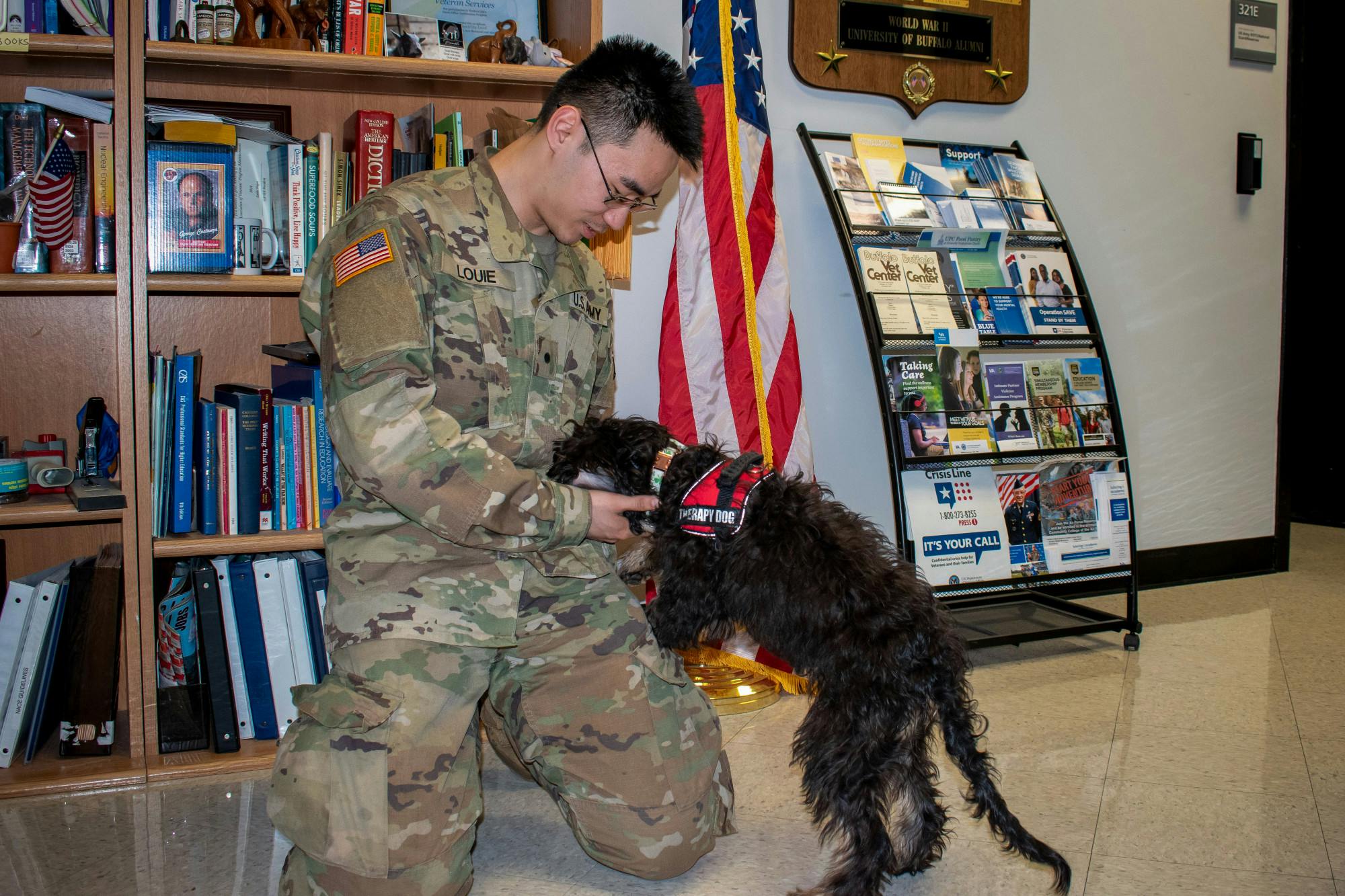 Jason Louie, a current member of the ROTC program at UB, stops in to spend some time with Finn.