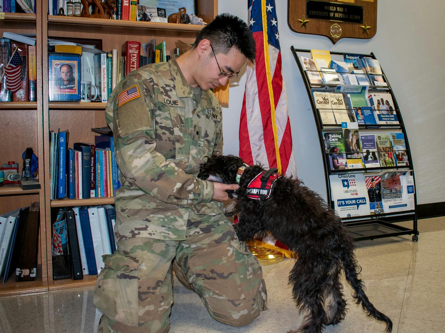 Jason Louie, a current member of the ROTC program at UB, stops in to spend some time with Finn.