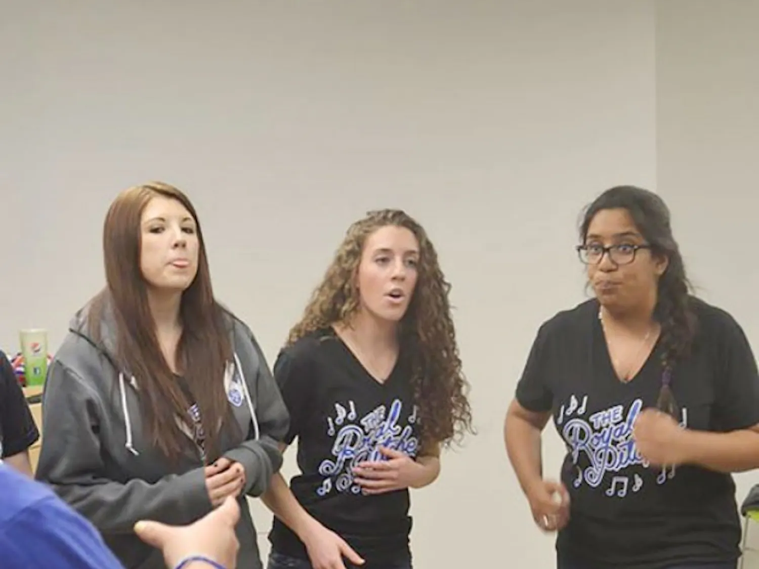Raquel Sosnovich, center, enjoys singing with the friends she made after joining The Royal Pitches. The Royal Pitches, an on-campus all-girls a capella group, provides Sosnovich, as well as many other girls, an opportunity to pursue their passion for singing. Courtesy of Lily Weisberg
