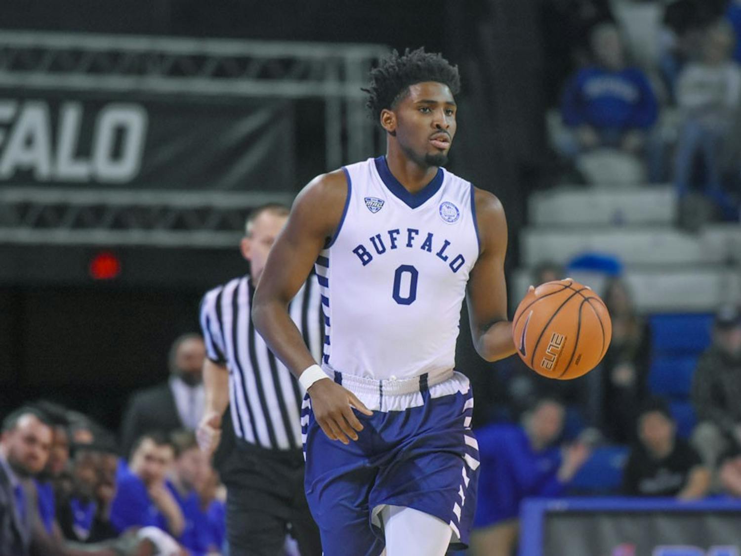 Senior Blake Hamilton dribbles the ball. The Bulls prepare themselves for tough competition at the MAC tournament this week.
