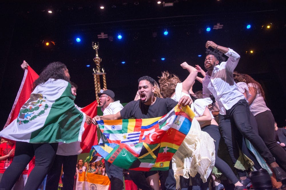 <p>Latin American Student Association (LASA) celebrate on stage after winning this year's International Fiesta. LASA's performance portrayed the troubles of immigration policies through&nbsp;zouk, Reggaeton and Rueda.</p>