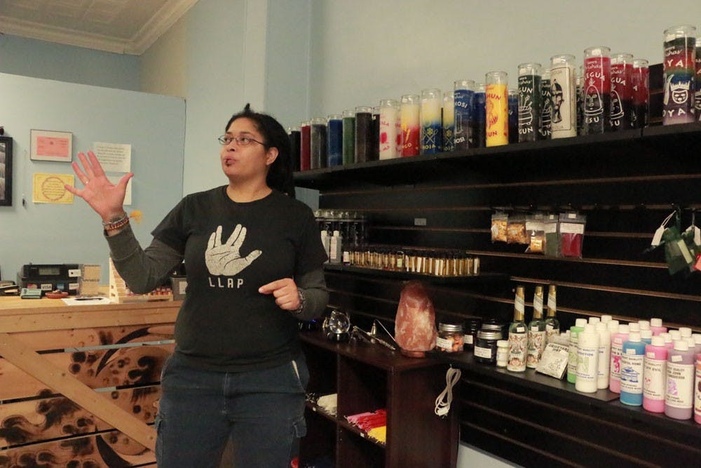 <p>Kurtlyn Cunningham, owner of Love, Light &amp; Magick, shows off some of her store’s goods. Love Light &amp; Magick is one of many spiritual specialty stores scattered around Buffalo, alongside Strange Brew in Kenmore and Spiritually Rooted in North Tonawanda, which form the core of Buffalo’s metaphysical community, often offering tarot readings, psychic development workshops and henna drawings.</p>