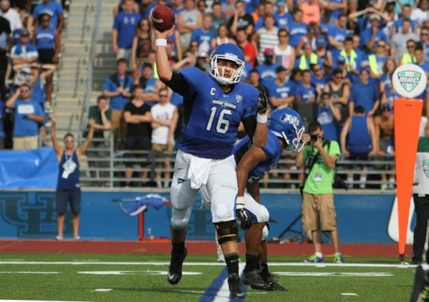 Former Buffalo quarterback Joe Licata throws a pass during a victory over Duquesne at UB Stadium his junior season.&nbsp;Licata and two former teammates will get a chance to continue their football careers in the NFL.&nbsp;