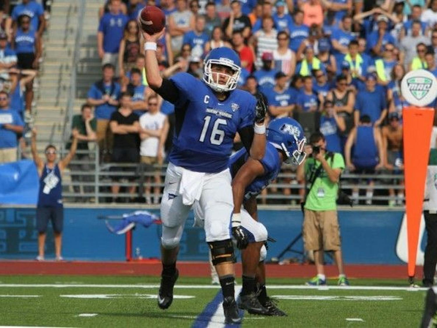 Former Buffalo quarterback Joe Licata throws a pass during a victory over Duquesne at UB Stadium his junior season. Licata and two former teammates will get a chance to continue their football careers in the NFL. 