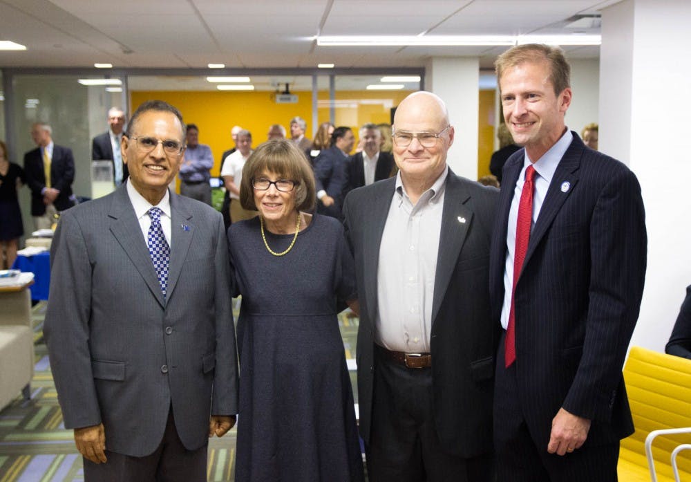 <p>(From L to R) President Satish Tripathi, Frank and Marilyn Clement and Dean Paul Tesluk at Wednesday’s ribbon-cutting ceremony for the new undergraduate center in the School of Management.</p>