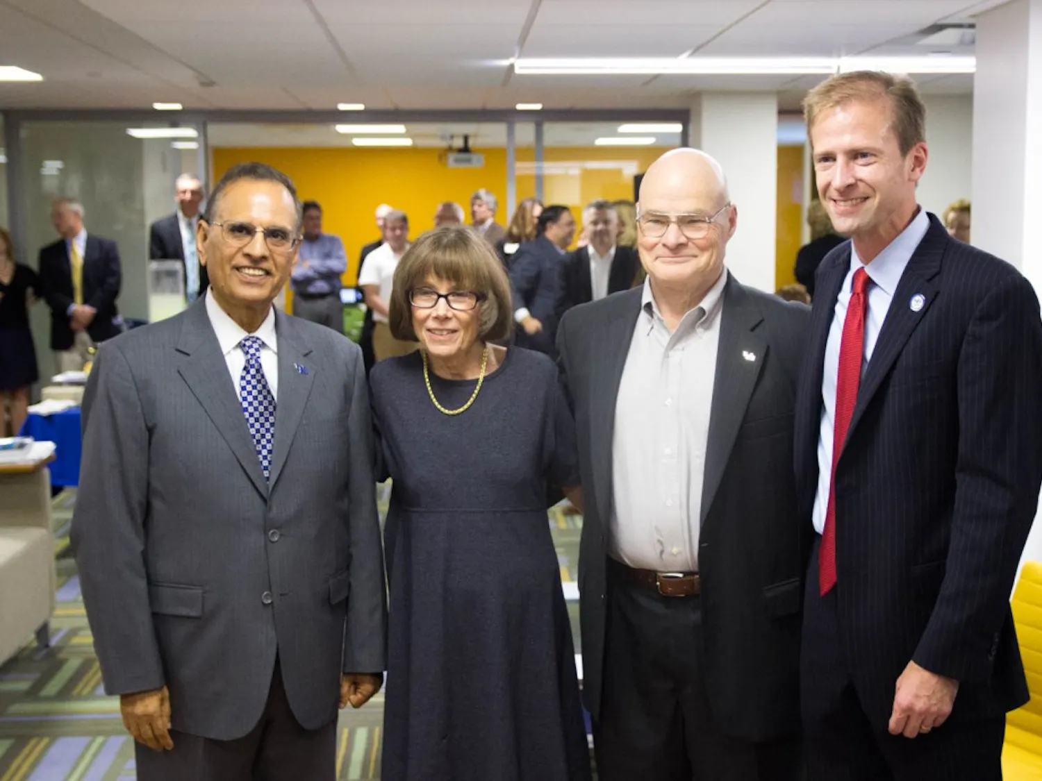 (From L to R) President Satish Tripathi, Frank and Marilyn Clement and Dean Paul Tesluk at Wednesday’s ribbon-cutting ceremony for the new undergraduate center in the School of Management.
