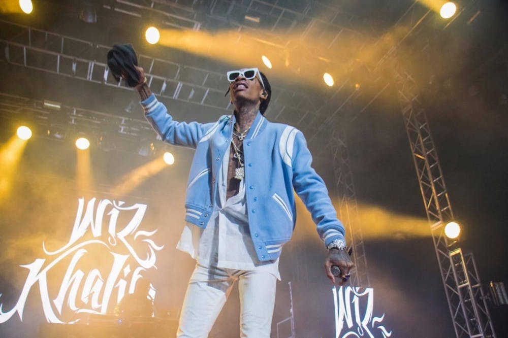 <p>Wiz Khalifa performs in Alumni Arena Friday night for this year's Spring Fest.&nbsp;Khalifa catered to fans old and new by playing a generous mix of his material.</p>