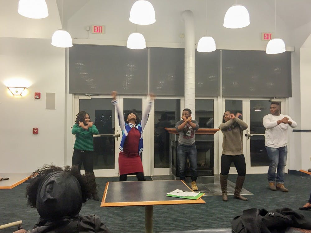 <p>UB Gospel Choir members perform during Friday's open mic night in the South Lake Village Community Center.&nbsp;</p>