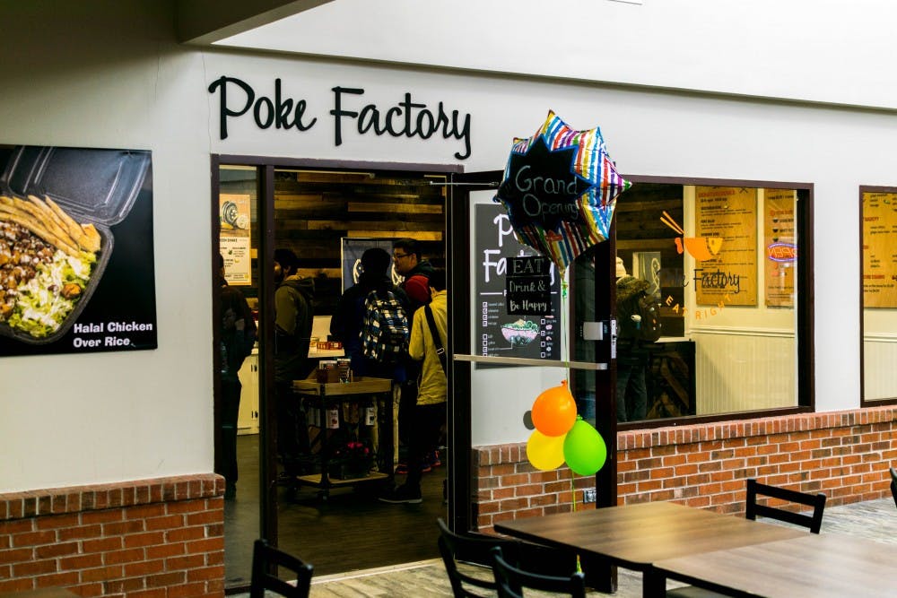 <p>Students ordering food at The Poké Factory during lunchtime. The Poké Factory opened its doors over spring break and serves poké, acai bowls, and smoothies</p>