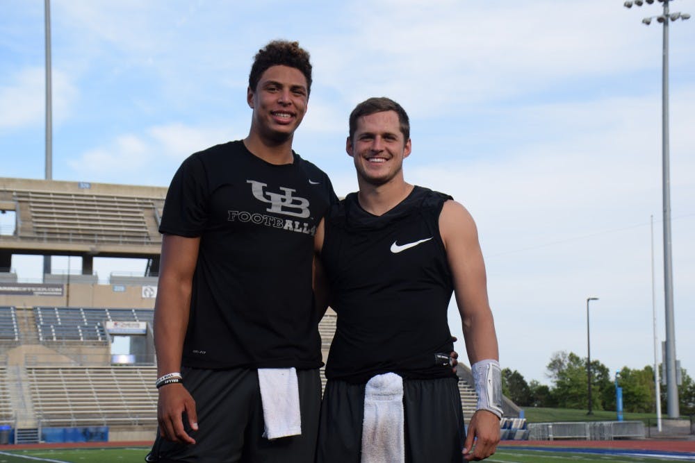 <p>Tyree Jackson (left) and Grant Rohach (right) stand on football stadium. Rohach will start for the Bulls on Friday against Albany, but Jackson will get playing time also.</p>