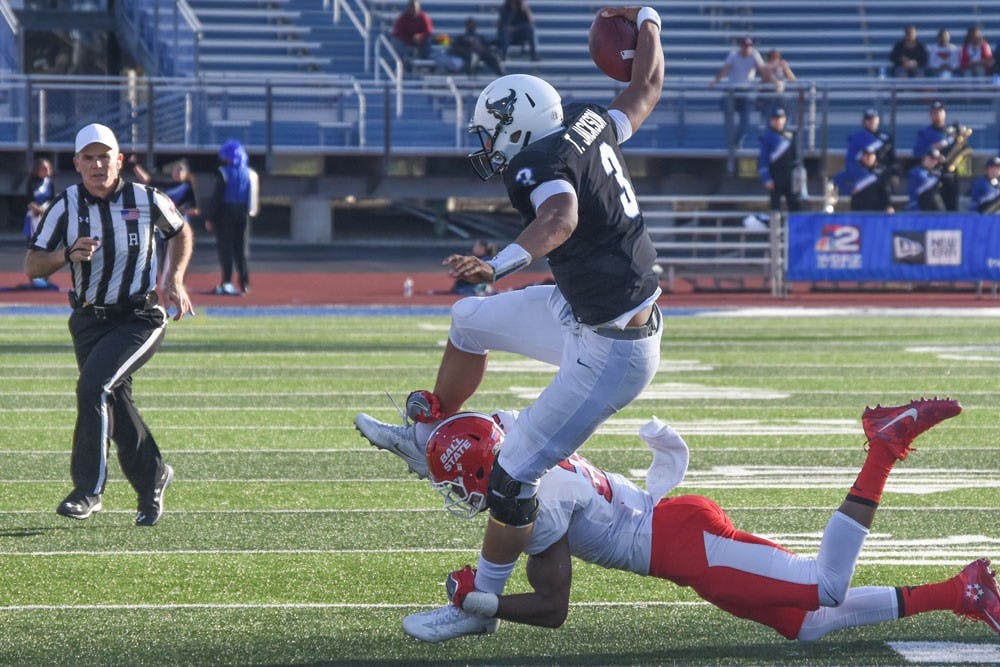 <p>Buffalo freshman quarterback Tyree Jackson tries to break away from Ball State.&nbsp;Jackson finished the day with career highs in both yards and touchdowns.</p>