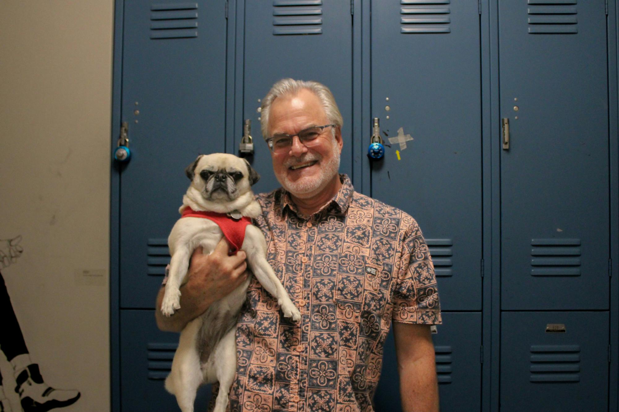 Jeff Sherven poses with Dixie, his pug and UB's pet celebrity.