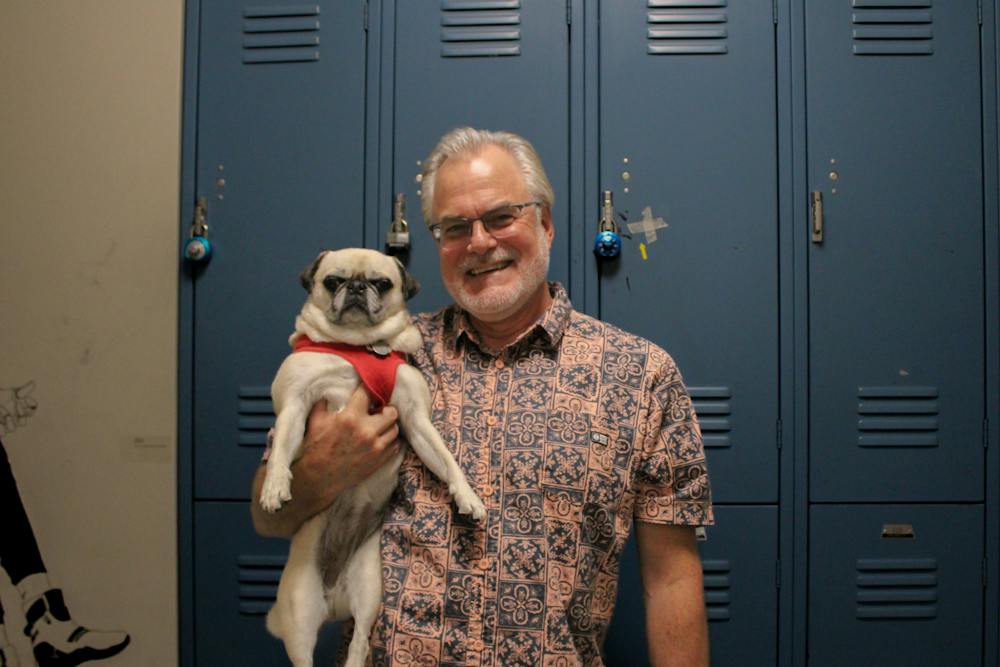Jeff Sherven poses with Dixie, his pug and UB's pet celebrity.