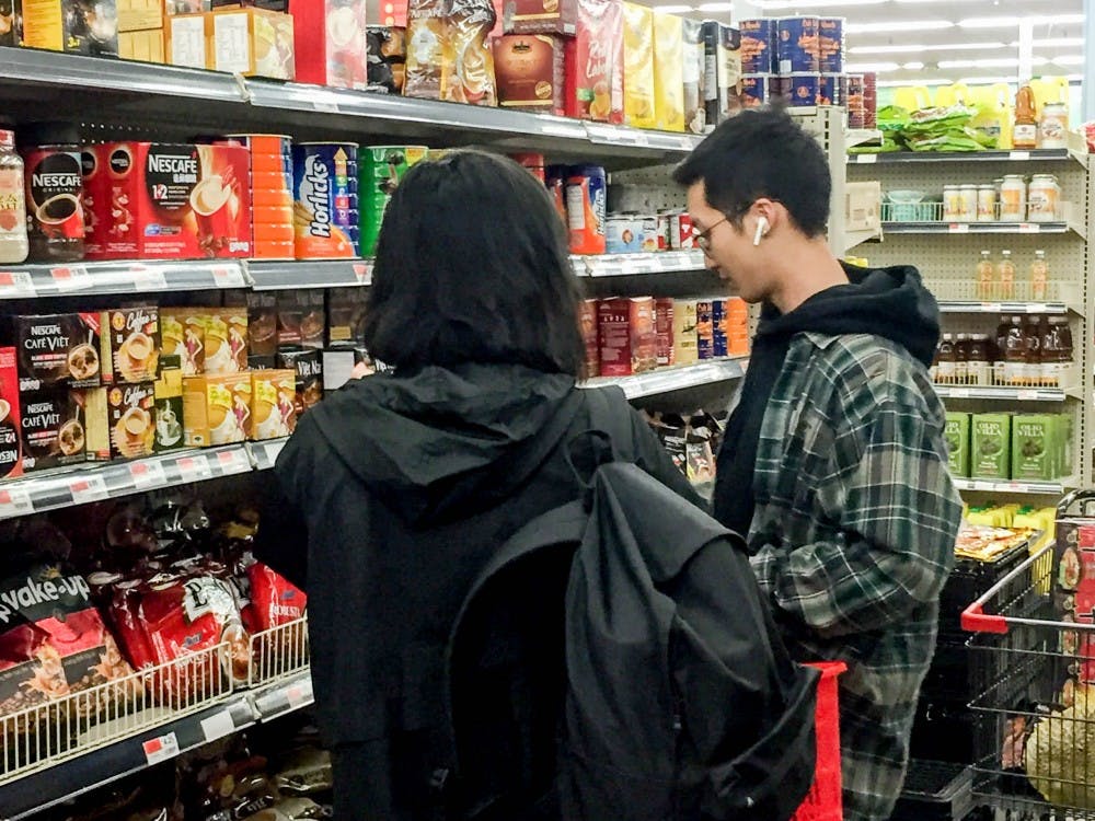 <p>Two students shopping at Asia Food Market. The new market bus brings students to and from the market every Tuesday from 4 p.m. to 8 p.m., and has already transported hundreds of students to the market.</p>