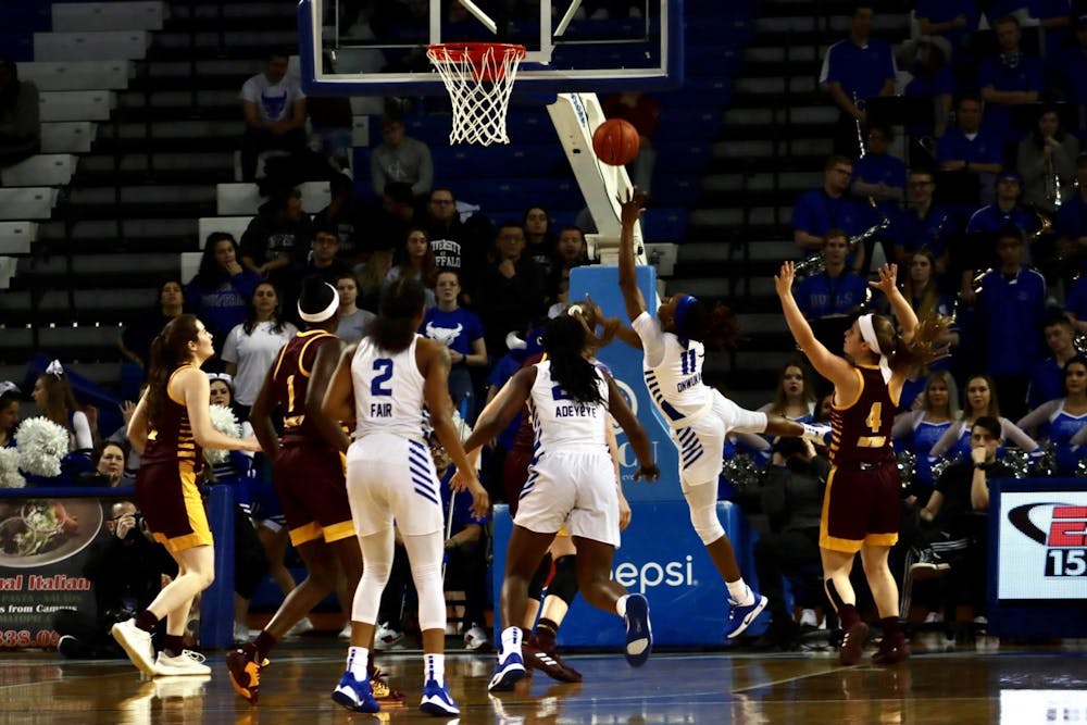 <p>Senior guard Theresa Onwuka goes for a successful layup at Wednesday's game against Central Michigan.</p>