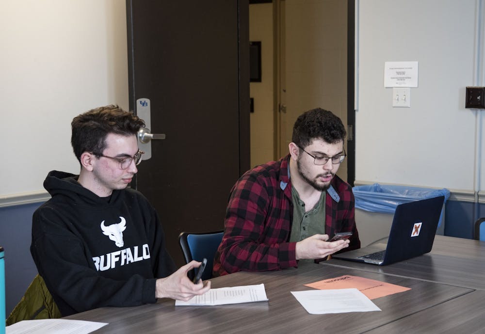 <p>Sophomore Brendan Kelly and UB College Democrats President Brandon Hoolihan at the phone banking drive (left to right).</p>