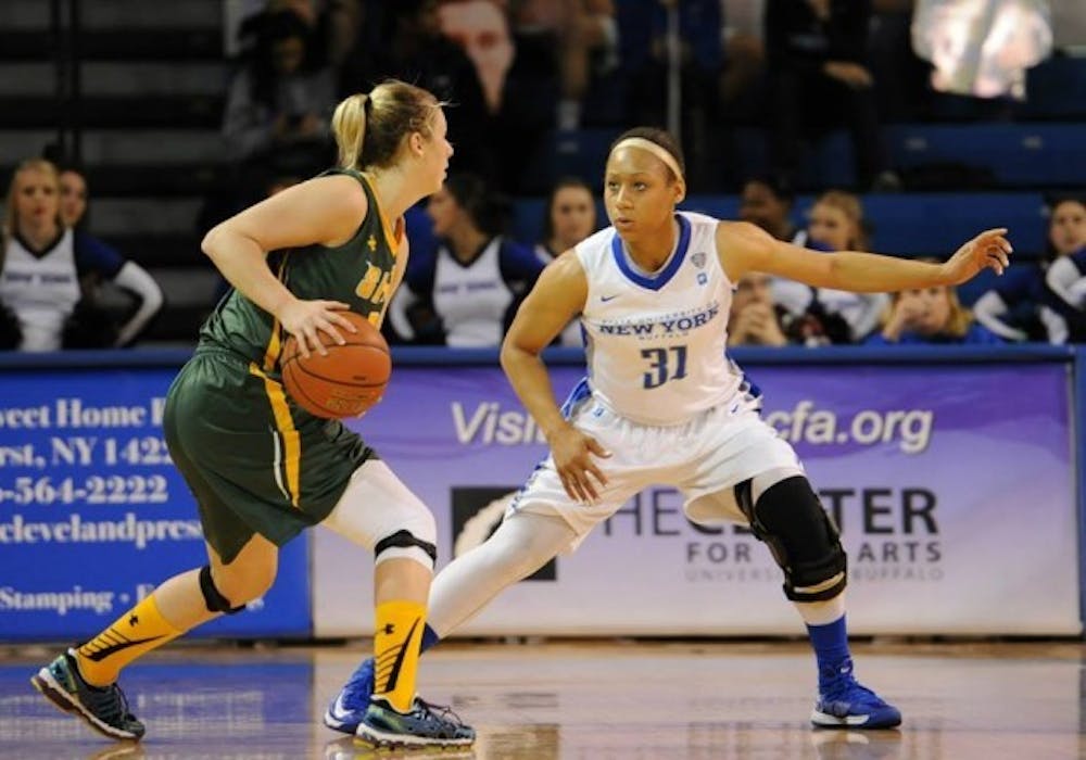 Sophomore guard Rachael Gregory defends a Siena player in Buffalo&#39;s opening loss. The Bulls responded to beat St. Francis, 88-80, on the road Tuesday.
Yusong Shi, The Spectrum