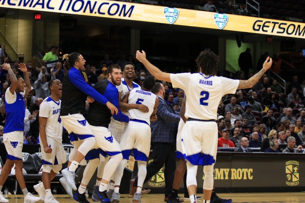 <p>Junior forward Jeremy Harris celebrates towards the bench during the MAC Championship tourney. Men’s basketball would celebrate its best season in school history winning its first-ever NCAA Tournament game.</p>