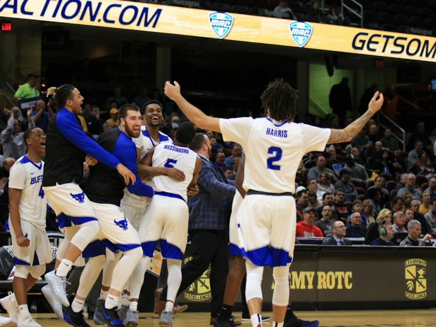 Junior forward Jeremy Harris celebrates towards the bench during the MAC Championship tourney. Men’s basketball would celebrate its best season in school history winning its first-ever NCAA Tournament game.