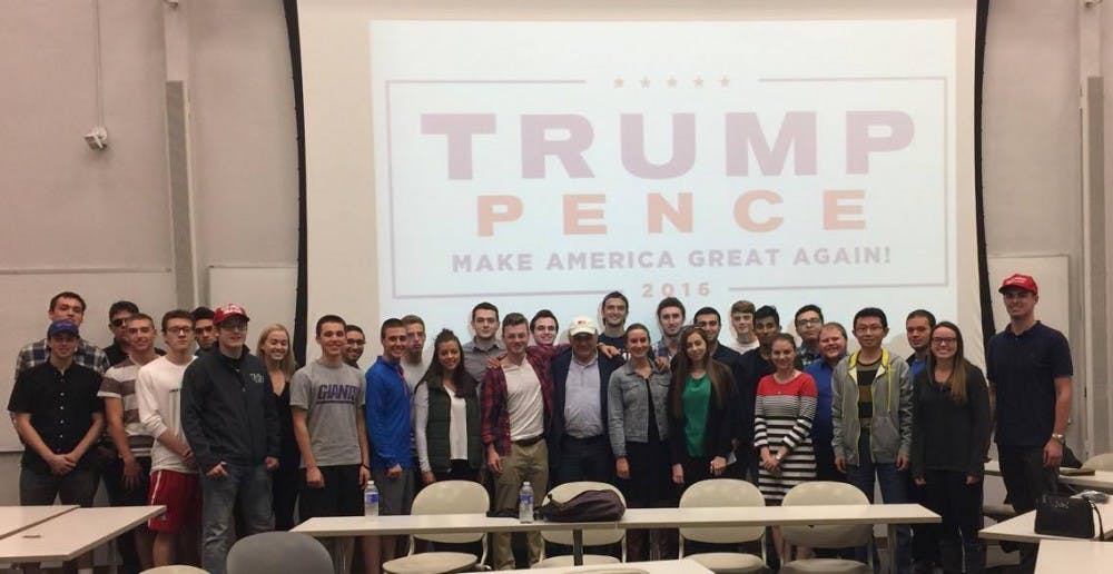 <p>UB College Republicans stand with Carl Paladino in Talbert Hall on Monday night. Paladino,&nbsp;Donald&nbsp;Trump's campaign co-chair, gave his perspective on the presidential&nbsp;election.</p>