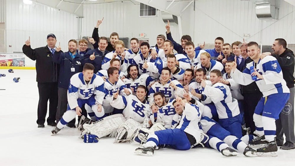 <p>The D-III men’s hockey team celebrate a 4-2 victory over Penn State this past Sunday. The Bulls brought home their first-ever NCHA Championship this past weekend.</p>