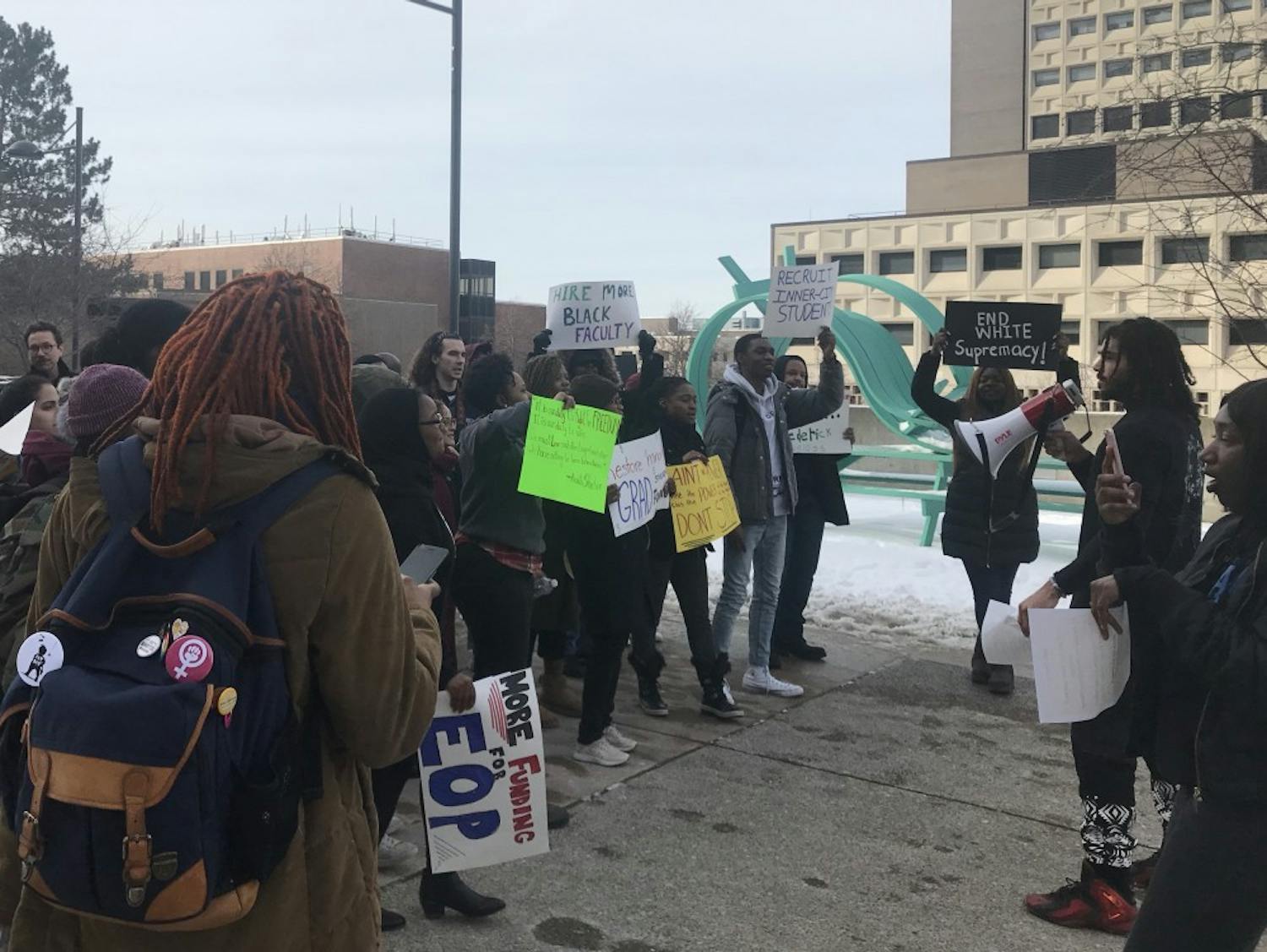 Students gathered in the academic spine Friday afternoon to protest UB’s treatment of the African and African American Studies program. The protesters marched to the Student Union to speak out against the “war” on AAS.