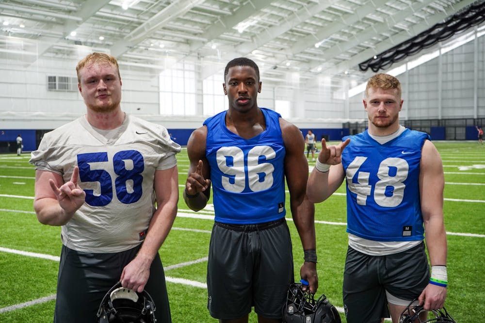 <p>Offensive lineman Alain Schaerer (left), defensive end Jordan Avissey (middle), and linebacker Fabian Weitz (right) speak about their experiences being the only three members on the team from Europe in the fieldhouse on Tuesday.</p>