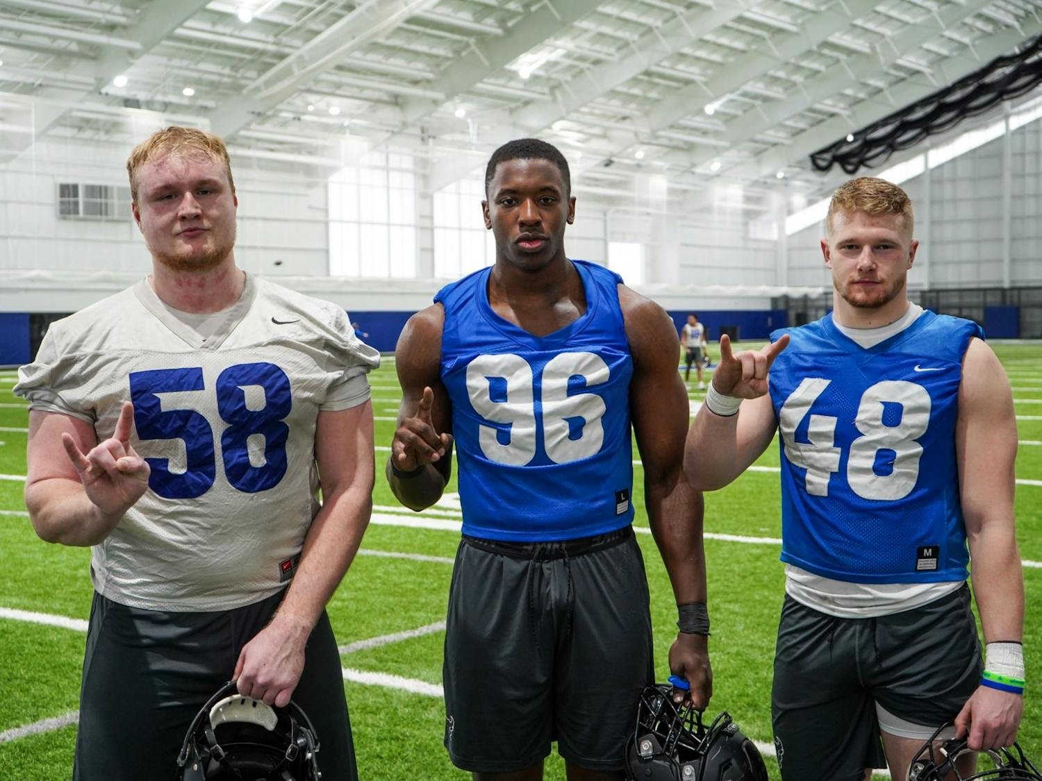 Offensive lineman Alain Schaerer (left), defensive end Jordan Avissey (middle), and linebacker Fabian Weitz (right) speak about their experiences being the only three members on the team from Europe in the fieldhouse on Tuesday.