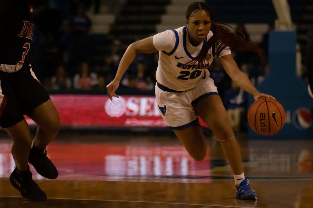 Graduate guard Re'Shawna Stone dribbles the ball in UB's Saturday game versus Northern Illinois.