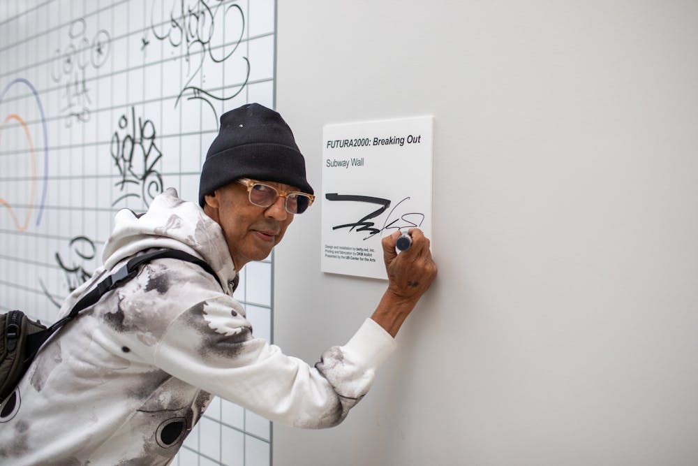<p>Futura tags the title card for his public art installation in the CFA lobby. The piece invites the community to add their own signatures and tags to a subway wall.&nbsp;</p>