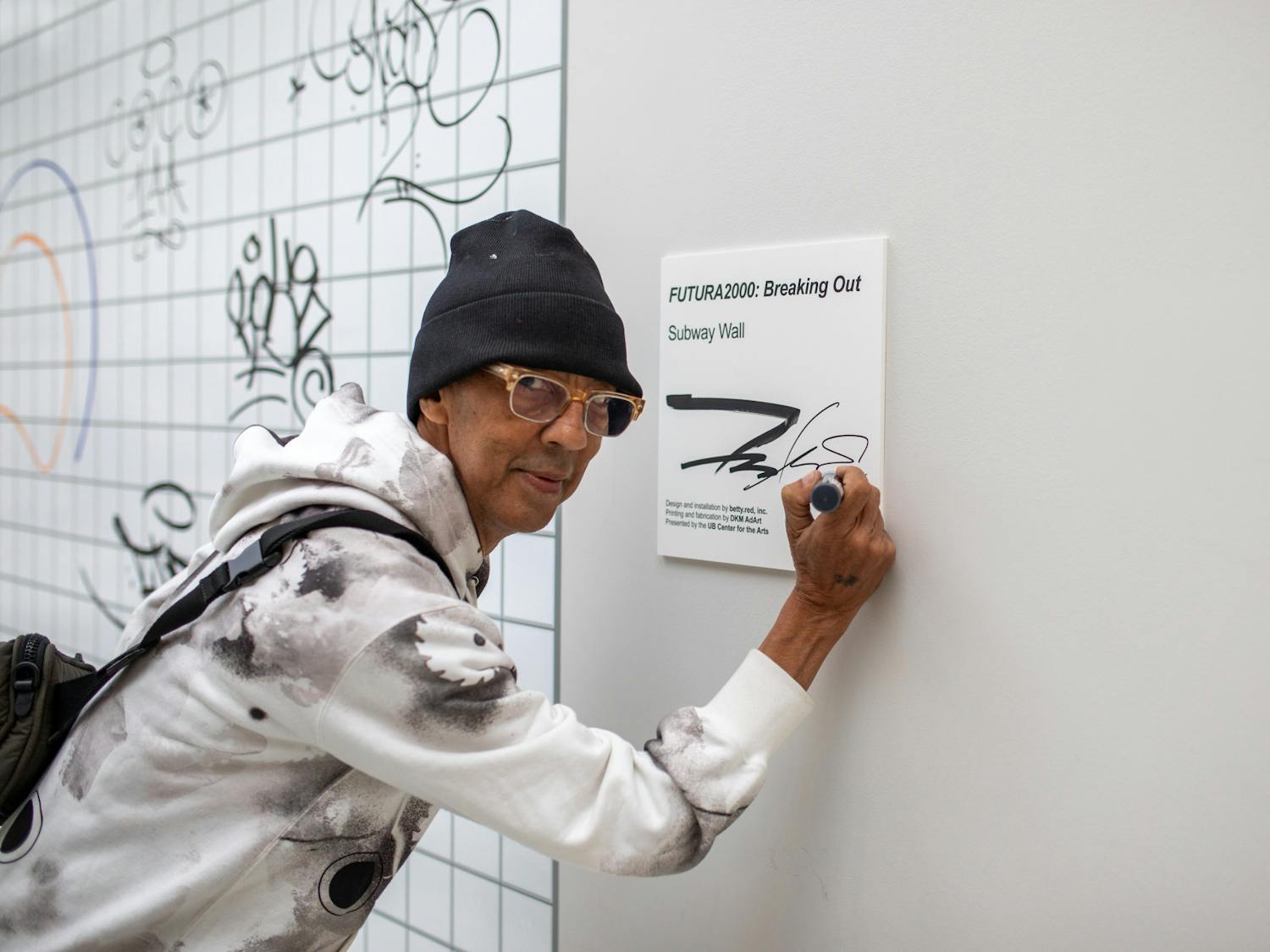 Futura tags the title card for his public art installation in the CFA lobby. The piece invites the community to add their own signatures and tags to a subway wall.&nbsp;