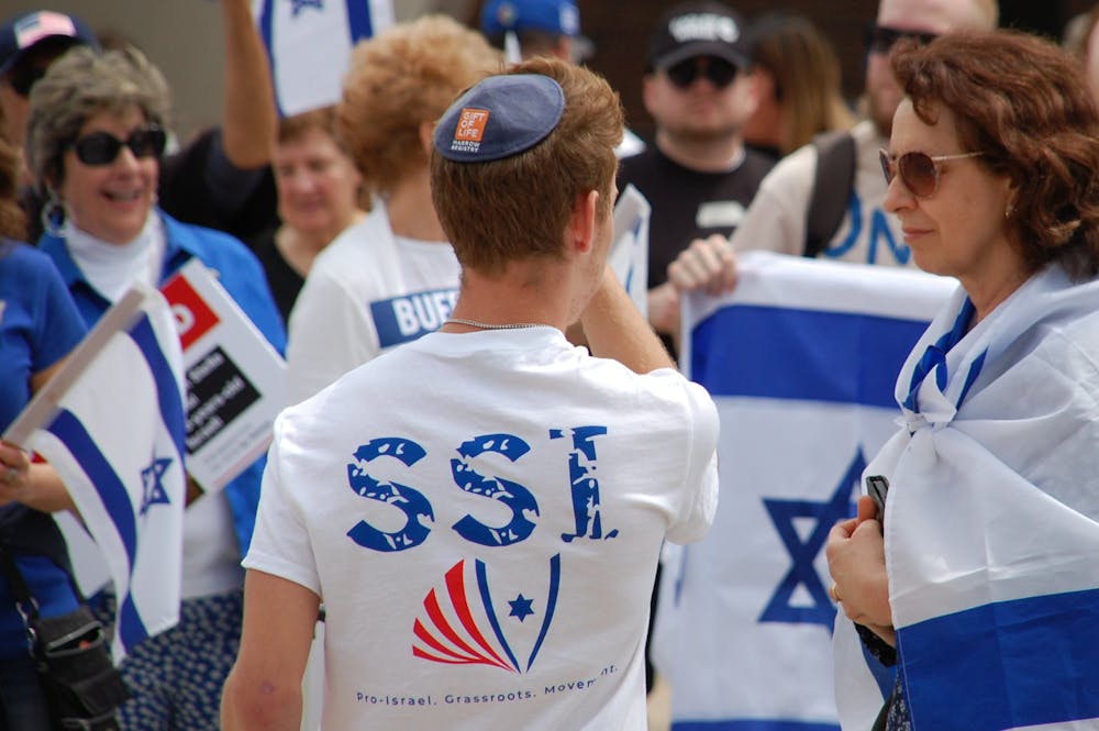 <p>Then-Students Supporting Israel (SSI) President Brandon Meyer wears a shirt promoting the group at a pro-Israel march on Monday, May 6, 2024. SSI is one of three groups targeted by the Communist Student League's letter.</p>