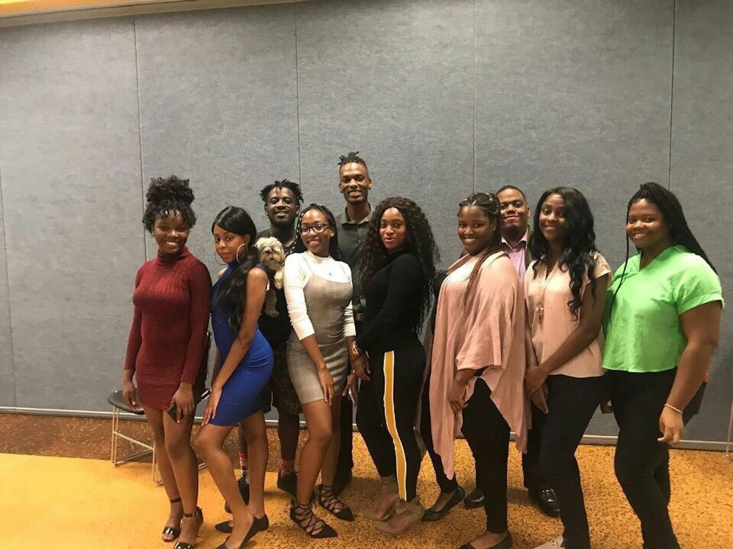 Members of Caribbean Student Association stand for a group portrait. CSA looks to make the club environment a safe place for students to talk about social issues on campus.