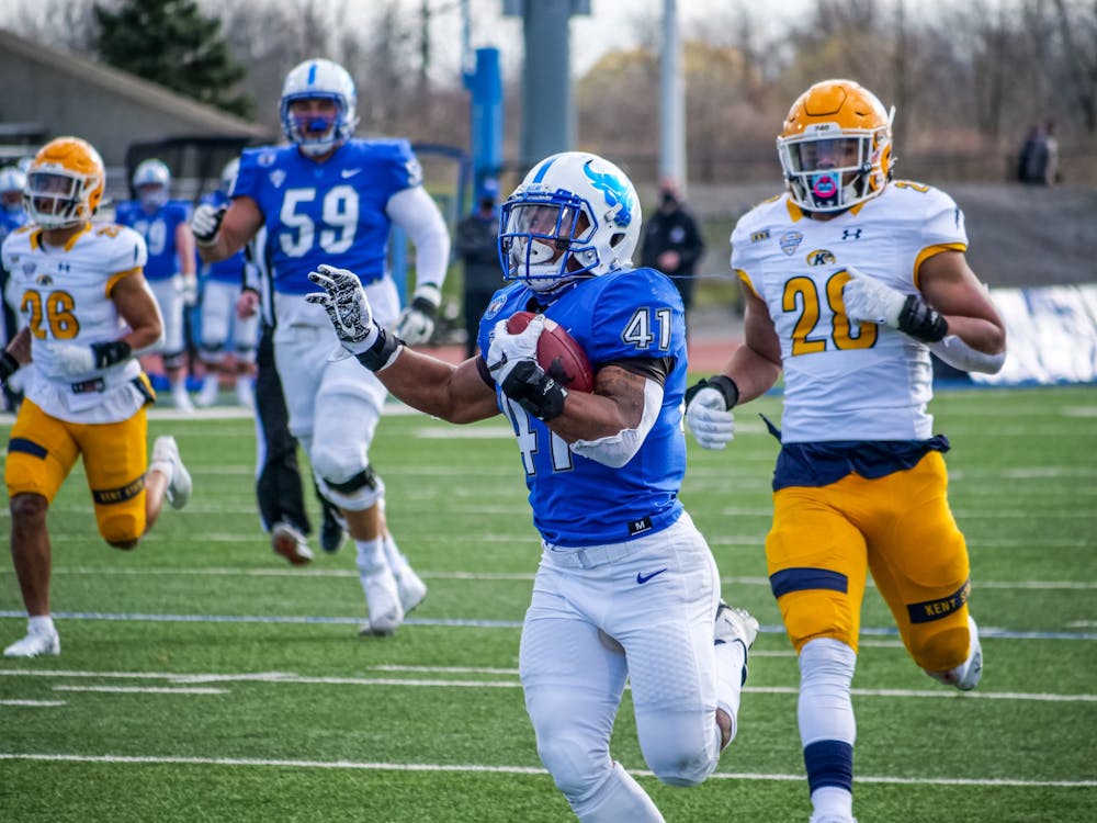 <p>UB running back Jaret Patterson (41) rushed for 409 yards and eight touchdowns in a 70-41 victory over the Kent State Golden Flashes Saturday.</p>