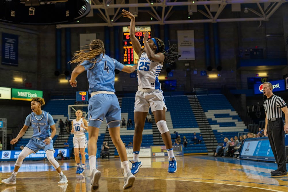 Sophomore forward Adebola Adeyeeye shoots a jumper. 