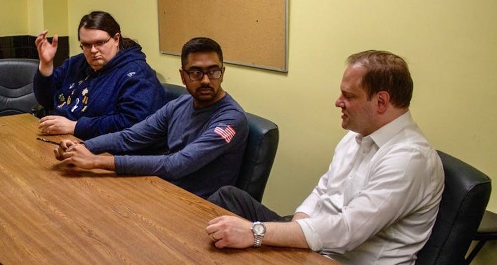 (Left to right) Connor Walters, Arsh Issany and Joshua Lippes discuss UB’s decision to dissolve Sub-Board I in The Spectrum's office in May. 