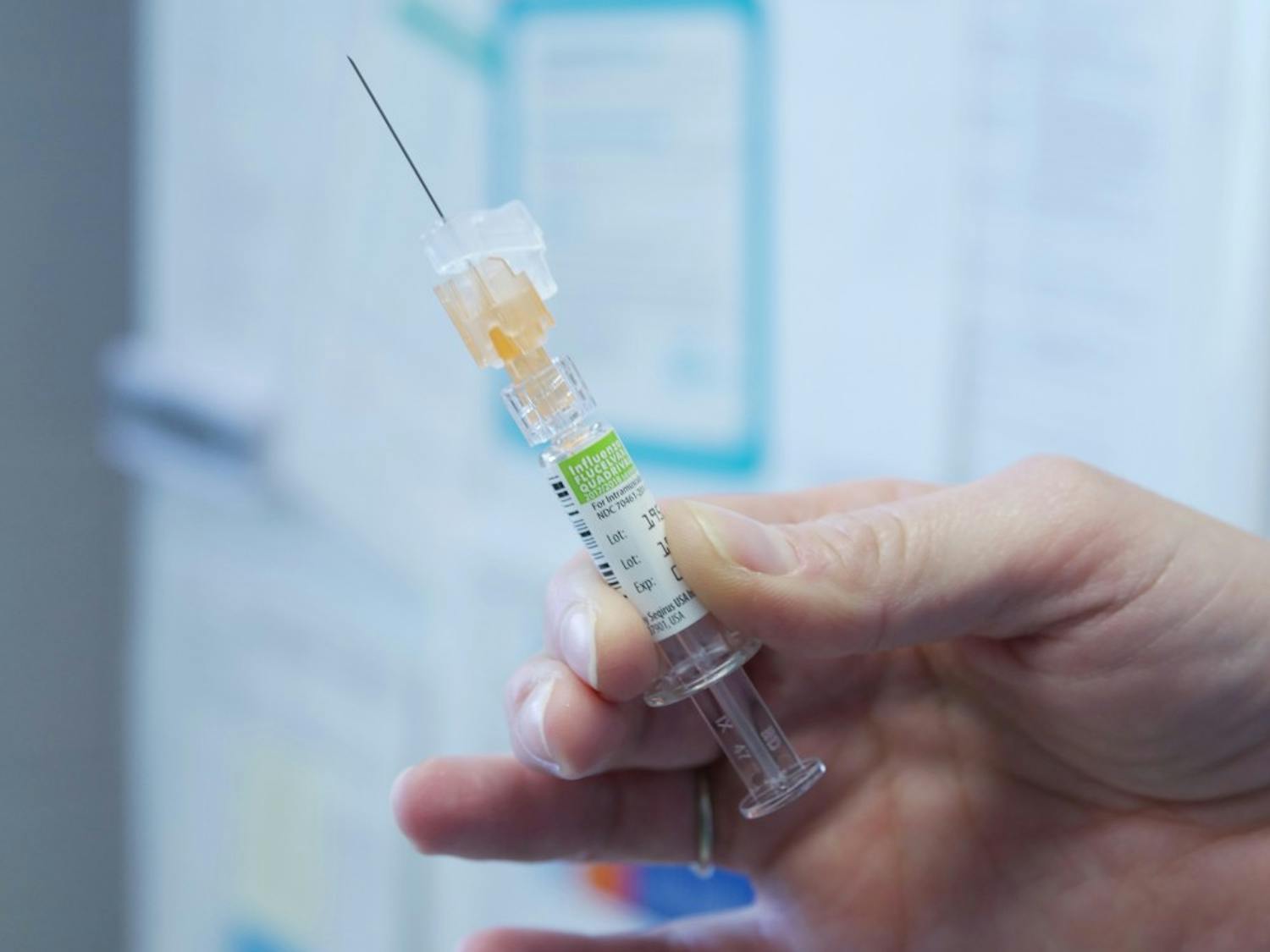 A vaccination syringe held by a UB student. Student Health Services has administered over 1,000 vaccinations to registered UB students.