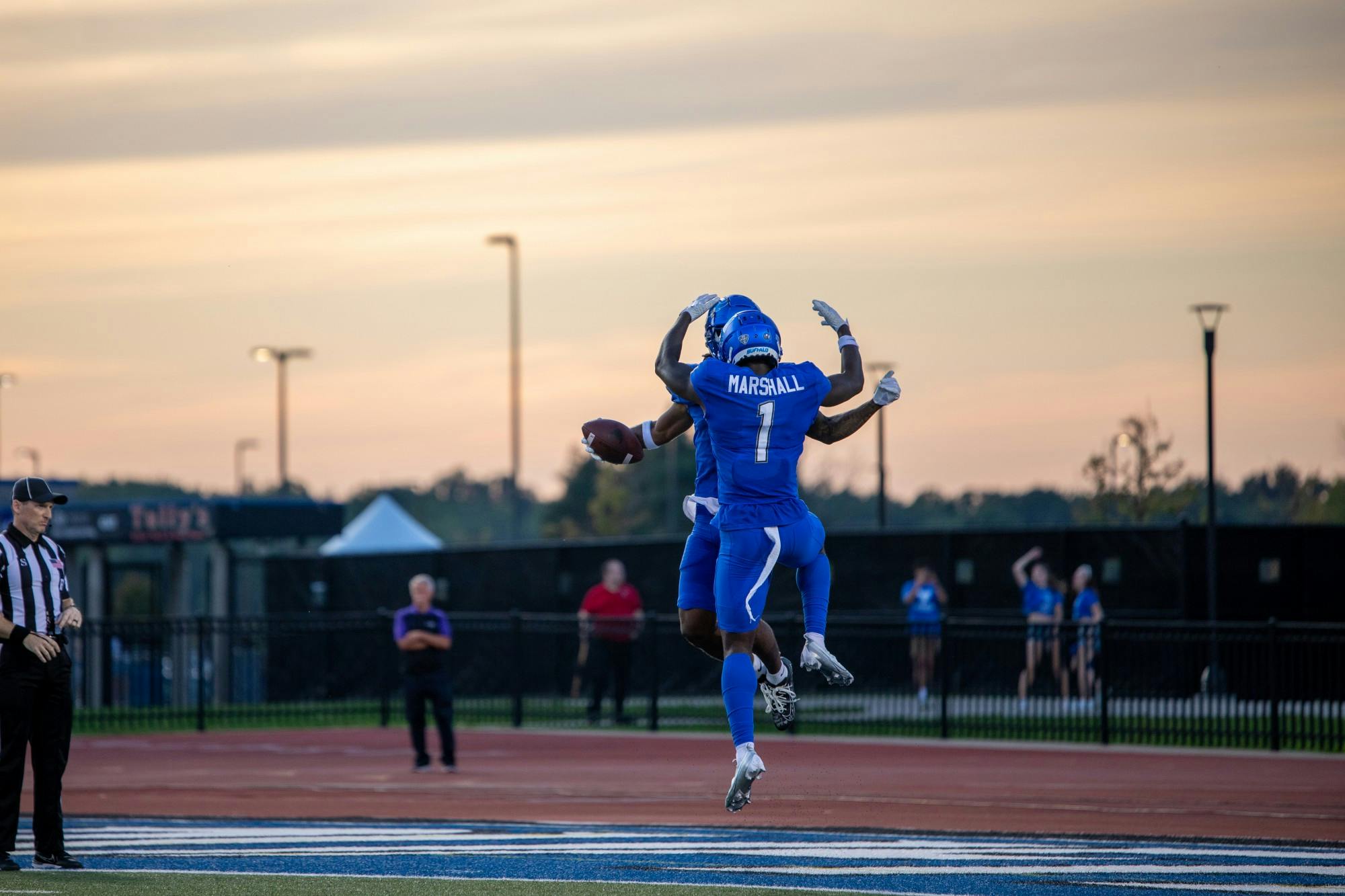 Graduate wide receivers Justin Marshall and Quian Williams celebrate a touchdown.
