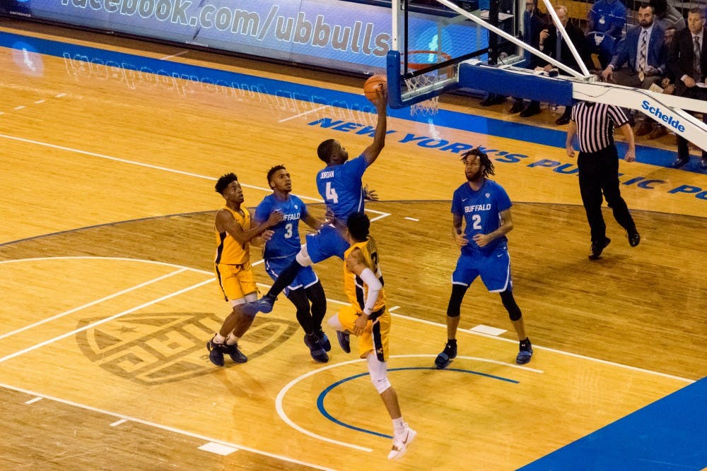 <p>Sophomore guard Davonta Jordan pushes in the paint for a layup. Jordan and the bulls are hoping to fix mental lapses so they can hold on to leads better in late game.</p>