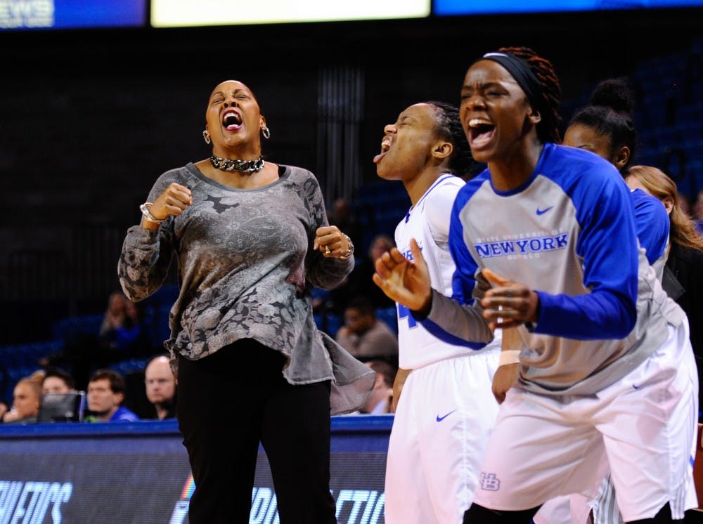 <p>Bulls head coach Felisha&nbsp;Legette-Jack and the bench celebrate during Buffalo's victory over Ball State in Alumni Arena on Feb. 6.&nbsp;</p>