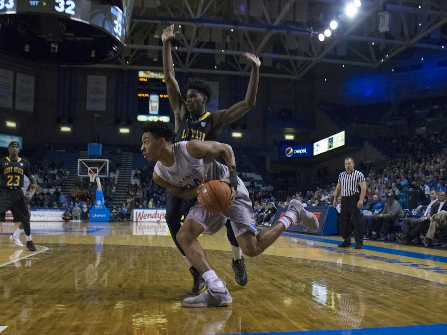 Freshman forward Quate McKinzie moves past a Kent State player. McKinzie made his first appearance since breaking his hand against the Ohio Bobcats in January.